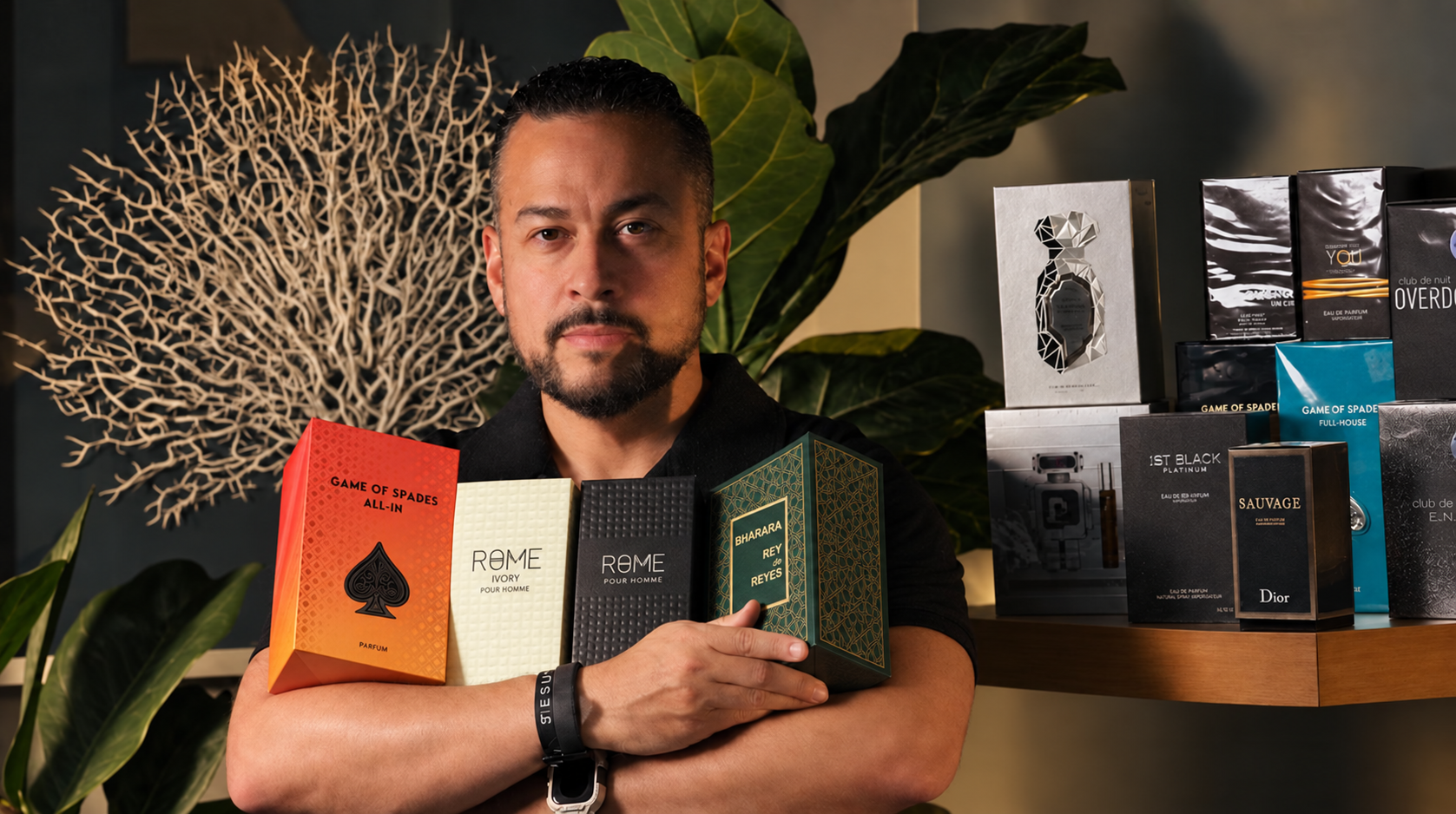 Joel Vazquez, founder and personal scent concierge at JV Fragrances LLC, with a curated fragrance collection