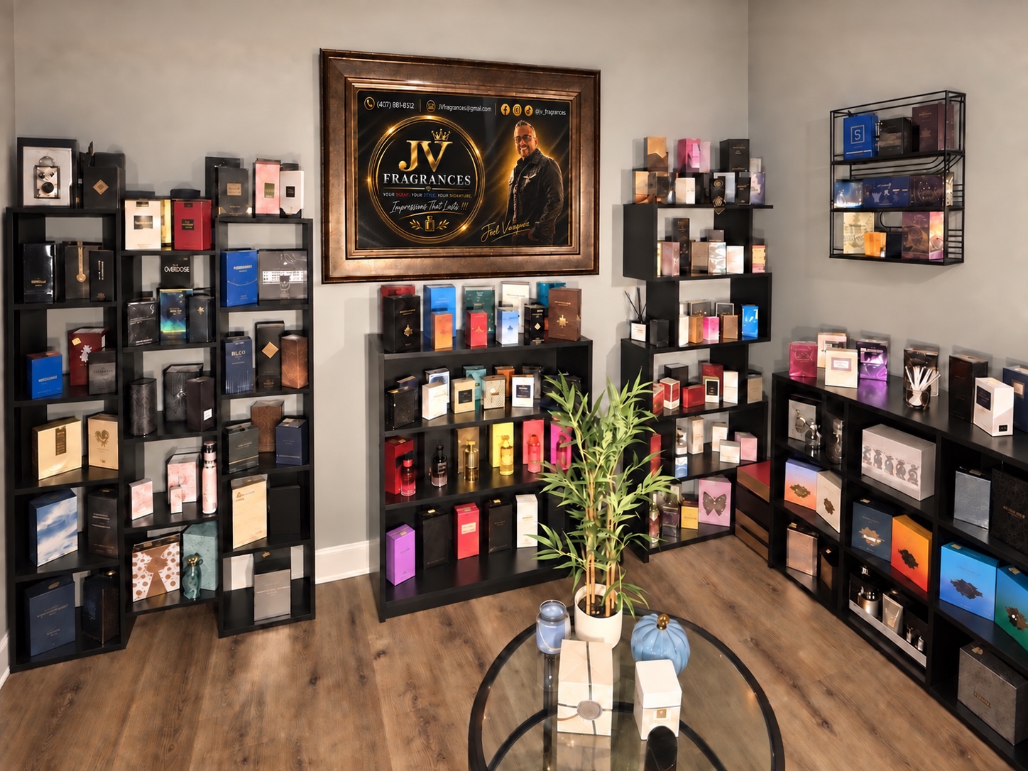 JV Fragrances LLC showroom with a curated fragrance collection and Joel Vazquez brand portrait